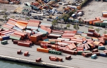 Shipping containers are shown fallen over on top of one another damaged by Typhoon Jebi..