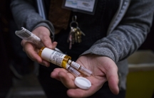 an overdose naloxone kit in a woman's hands