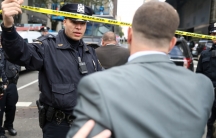 Police allow someone to pass outside the Time Warner Center