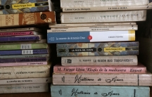 Books are shown in stacks, one of them is by Peruvian-Spanish writer Mario Vargas Llosa, winner of the 2010 Nobel Prize in Literature.