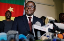 Cameroon opposition candidate smiles during a news conference at his headquarters in Yaoundé, Cameroon 