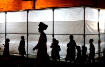the silhouettes of members of the ultra orthodox community in Jerusalem