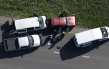 Law enforcement personnel investigate the scene where the Texas bombing suspect blew himself up on the side of a highway north of Austin in Round Rock, Texas, March 21, 2018.