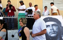 Cuba's First Vice-President Miguel Diaz-Canel and his wife Lis Cuesta stand in line before Diaz-Canel casts his vote during an election of candidates for the national and provincial assemblies.