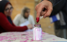 A voter's finger is marked with ink at a polling station during the second day of the presidential election in Alexandria, Egypt, March 27, 2018. 
