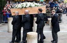 Pallbearers carry the coffin of Stephen Hawking into Great St. Mary's Church.