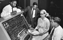Grace Hopper sits behind the UNIVAC (universal automatic computer) keyboard in the early '60s. As a mathematician and rear admiral in the US Navy, she helped design the UNIVAC I and many other related systems.