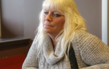 Medium close up of Mo Korchinski sitting in a coffee shop.