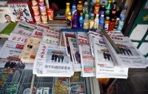 Chinese newspapers featuring a picture of US President Donald Trump a