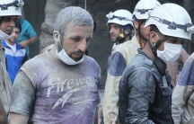 Residents and members of the Syrian Civil Defense, or