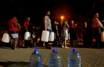 People queued to collect water as fears over the city's water crisis grew earlier this year in Cape Town, South Africa.