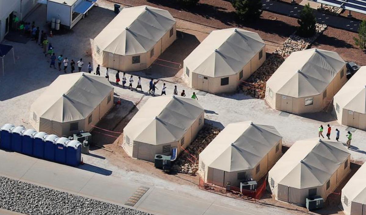 an aerial view of a tent camp for detained migrant children in the US