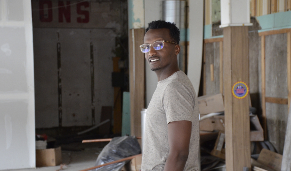 Hamissi Mamba walks through the guts of what will be his new restaurant, Baobab Fare in Detroit. Originally from Burundi, Mamba relocated to Michigan two years back, learned English, and is now a budding entrepreneur.