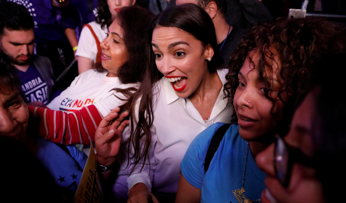 Alexandria Ocasio-Cortez greets supporters at her midterm election night party
