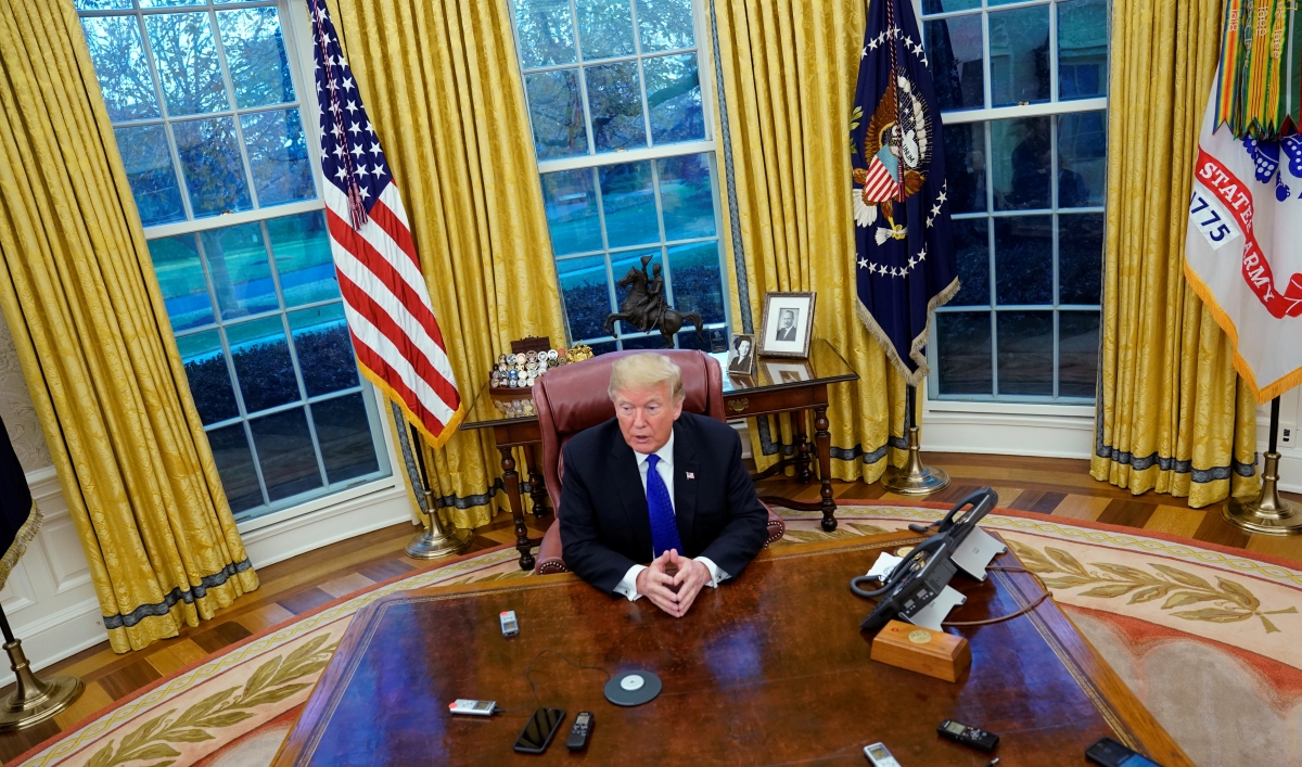 President Donald Trump answers questions during an exclusive interview with Reuters journalists in the Oval Office at the White House in Washington, DC on December 11, 2018. Asked about his past business connections with Russia, Trump said, "The stuff yo