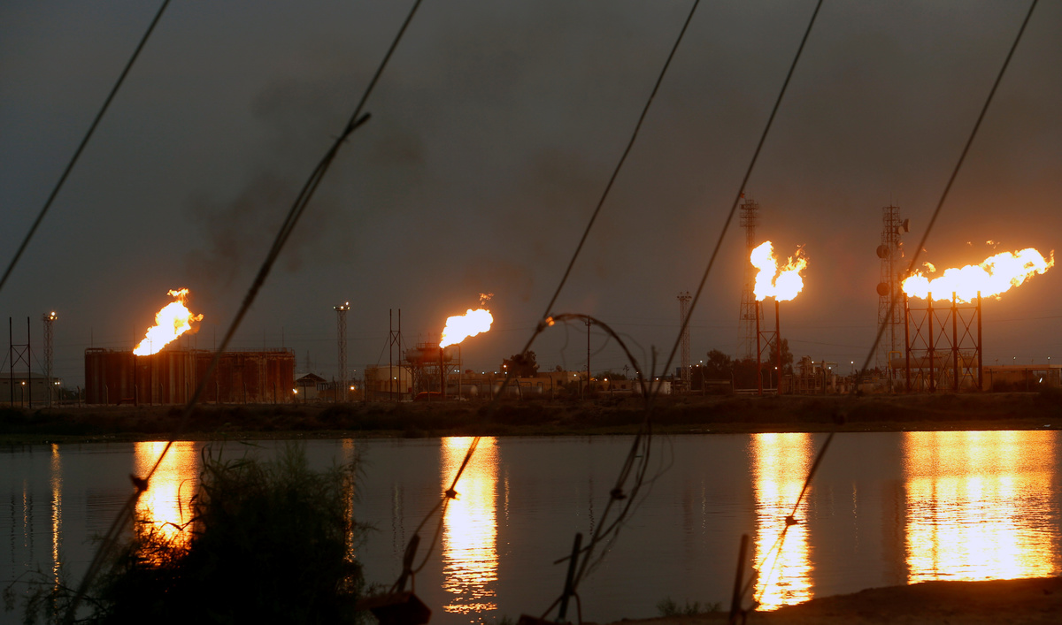 Flames emerge from flare stacks at Nahr Bin Umar oil field, north of Basra, Iraq, on Sept. 16, 2019.