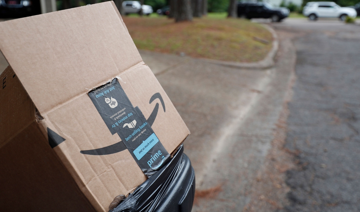 An empty Amazon box sits outside a north Jackson, Miss., residence, awaiting pickup for recycling
