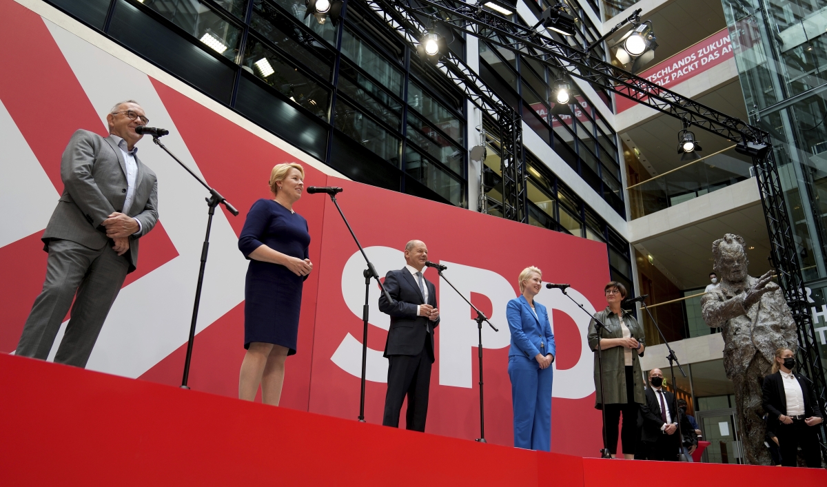 Olaf Scholz, center, top candidate for chancellor of the Social Democratic Party (SPD), speaks during a press conference at the party's headquarters in Berlin, Germany