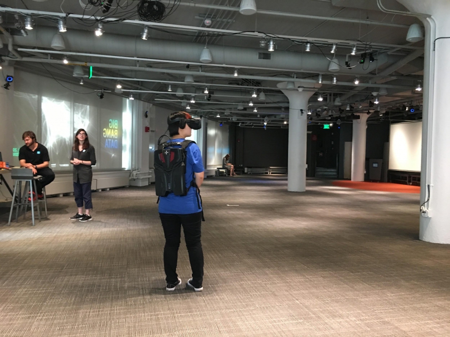 An MIT students goes through The Enemy exhibition at the MIT Museum
