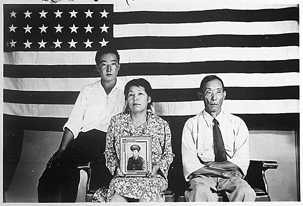 The Hirano family, left to right, George, Hisa, and Yasbei. Colorado River Relocation Center, Poston, Arizona, 1942 - 1945.