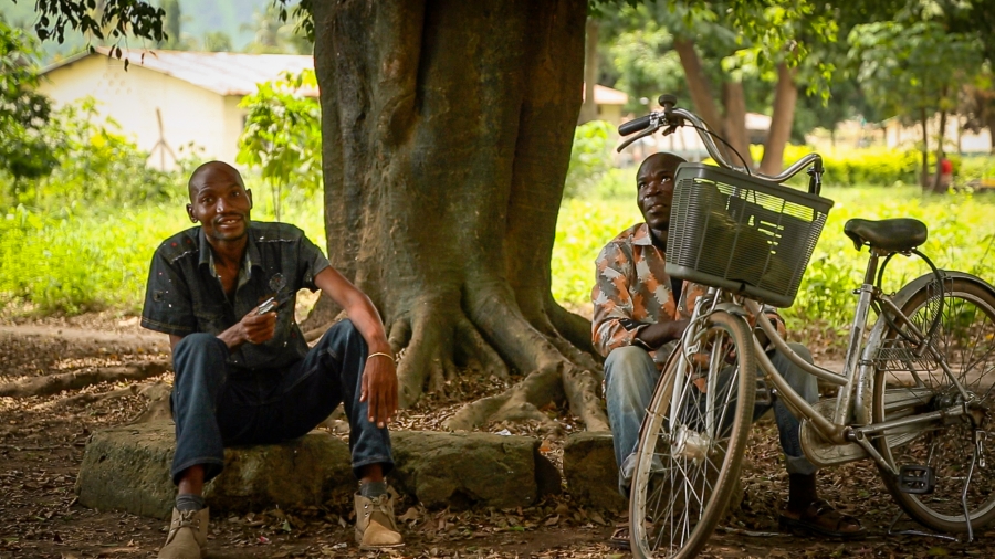 Bat tree Two men rest under a group of trees that's home to hundreds of fruit bats in the town of Kilombero. The trees are a favorite shaded spot for people traveling the hot and busy stretch of road along Tanzania's Kilombero Valley, leading to concerns about inf