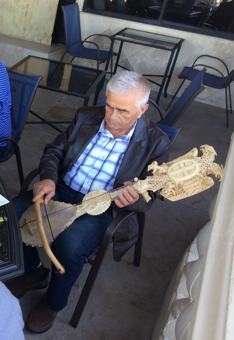 A patron at the Q2 Café in Phoenix plays the gusle. A patron at the Q2 Café in Phoenix plays the gusle.
