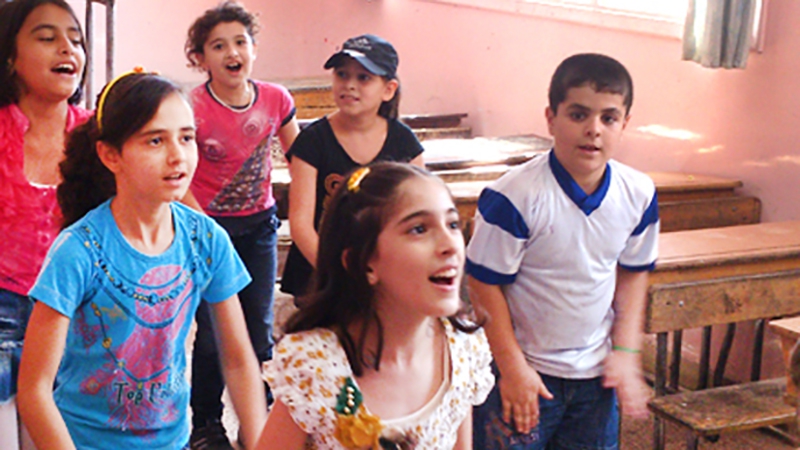 Syrian children play during a Questscope informal education class in Damascus. Syrian children play during a Questscope informal education class in Damascus.