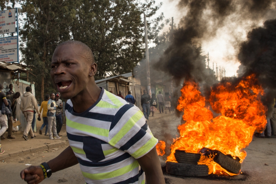 “Uhuru must go!” yells a demonstrator in Kibera, an informal settlement in Nairobi, Kenya. The man blamed current President Uhuru Kenyatta for the lack of jobs and widespread poverty in the area, and demanded that the President step down from office. “Uhuru must go!” yells a demonstrator in Kibera, an informal settlement in Nairobi, Kenya. The man blamed current President Uhuru Kenyatta for the lack of jobs and widespread poverty in the area, and demanded that the President step down from office.