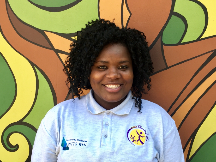 Awelani Neluonde lives in Johannesburg. She hopes that one day she could get an injection that would protect her from HIV infection. Awelani Neluonde stands in front of a mural outside of hospital in Johannesburg.