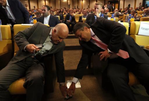 German Economy and Energy Minister Sigmar Gabriel (R) and Iranian Oil Minister Bijan Namdar Zanganeh (L) fall all over each other at Iran's Chamber of Commerce in Tehran on July 20, 2015, days after the nuclear accord was struck. German Economy and Energy Minister Sigmar Gabriel (R) and Iranian Oil Minister Bijan Namdar Zanganeh (L) fall all over each other at Iran's Chamber of Commerce in Tehran on July 20, 2015, days after the nuclear accord was struck.