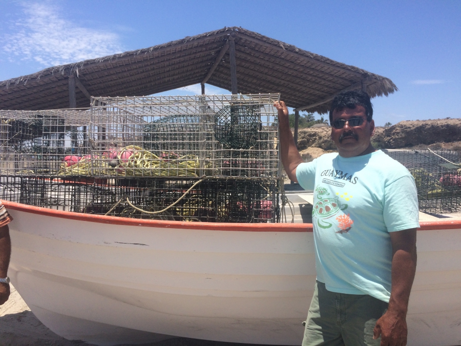 Aguillar Fisherman Juan Luis Aguilar stands by his boat full of lobster traps and nets on the beach at San Juanico. He and other members of the local fishing cooperative fear the proposed undersea phosphate mine will put them out of business.