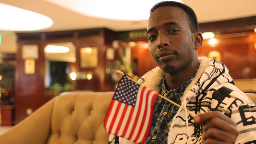 "Mr. America" shows off his adopted country's flag. "Mr. America" shows off his adopted country's flag.