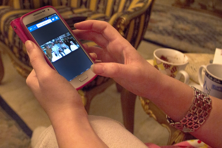 Maya Yamout shows a picture of ISIS supporters in the library of the Roumeih prison where she conducted interviews.