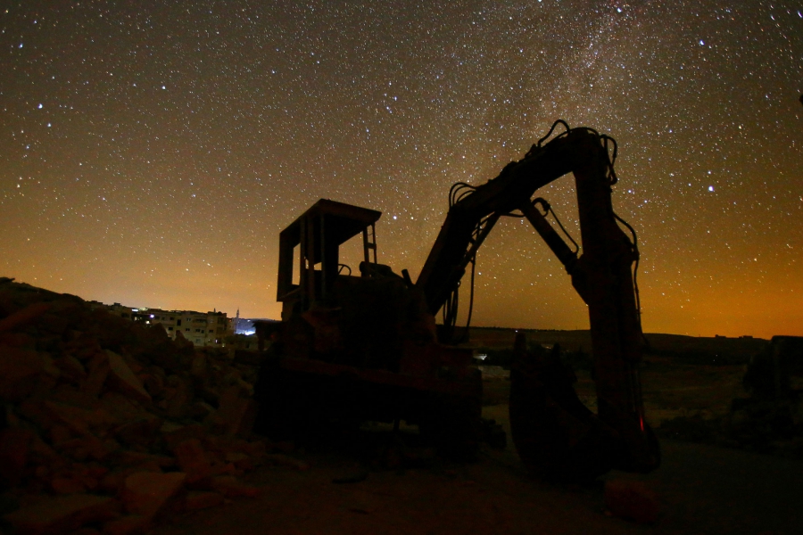 A digger stands amid the rubble in the rebel-controlled area of Maaret al-Numan in Idlib province. A digger stands amid the rubble in the rebel-controlled area of Maaret al-Numan in Idlib province.