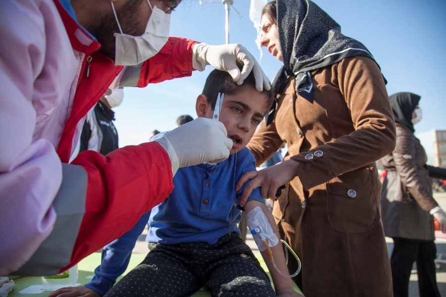A wounded boy is treated following an earthquake in Sarpol-e Zahab county in Kermanshah, Iran. A boy sheds a tear as he receives medical treatment to his forehead in Iran.