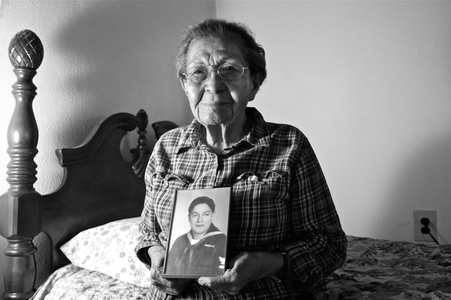 June Sarracino holding a photo of her husband Larry. June Sarracino holding a photo of her husband Larry.