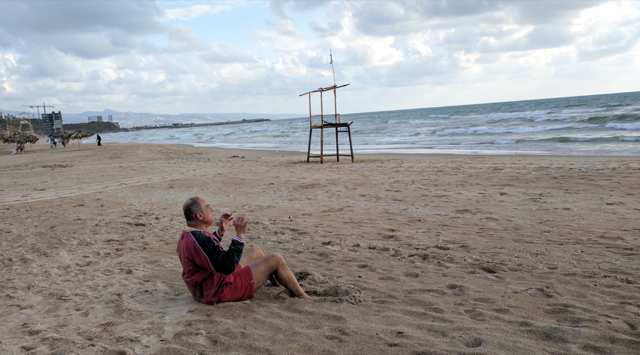 Beirut S Only Public Beach Is About To Be Taken Over By An Exclusive Adel A Regular Beach Goer Does Sit Ups In The Sand