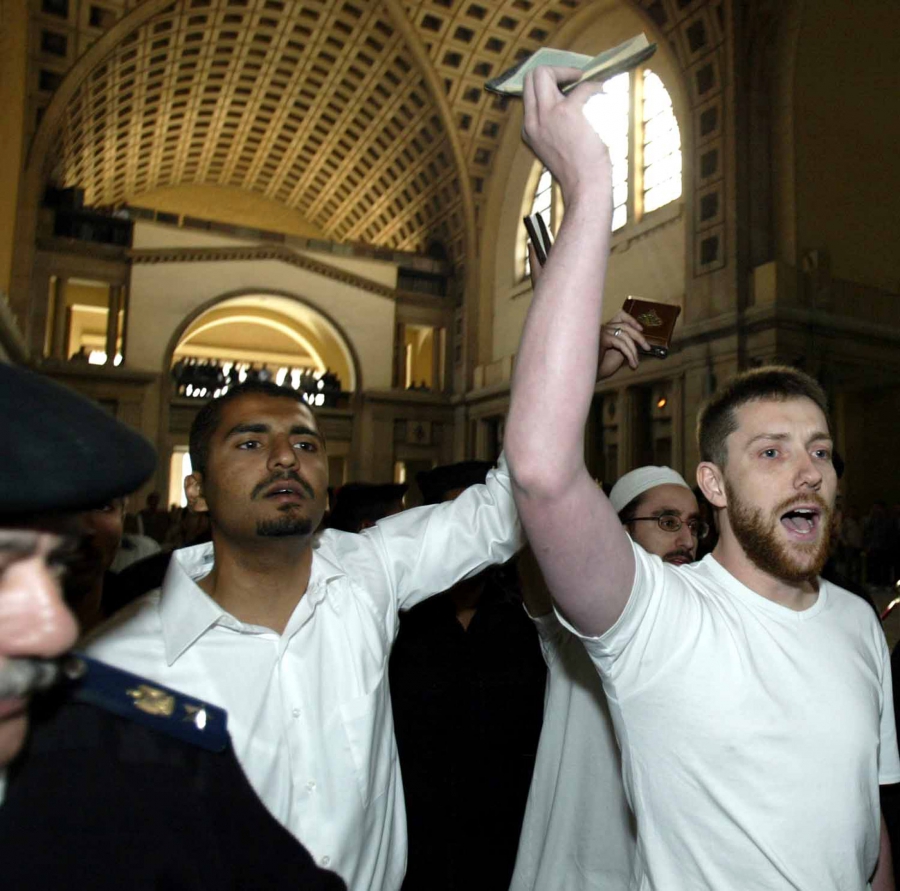 Maajid Nawaz (left) and fellow British citizen Ian Nisbet hold up copies of the holy Quran as they are led to court in Cairo, Egypt in March 2004. Nawaz and Nisbet were among a group of 26 people arrested in Egypt and sentenced to jail time for promoting Maajid Nawaz (left) and fellow British citizen Ian Nisbet hold up copies of the holy Quran as they are led to court in Cairo, Egypt in March 2004. Nawaz and Nisbet were among a group of 26 people arrested in Egypt and sentenced to jail time for promoting