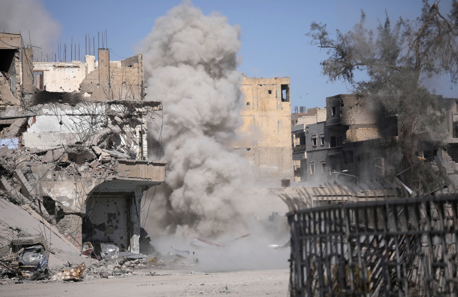 Smoke rises after a landmine exploded as fighters of Syrian Democratic Forces are clearing roads after liberation of Raqqa, Syria Oct. 18, 2017. Smoke rises after a landmine exploded as fighters of Syrian Democratic Forces are clearing roads after liberation of Raqqa, Syria Oct. 18, 2017.