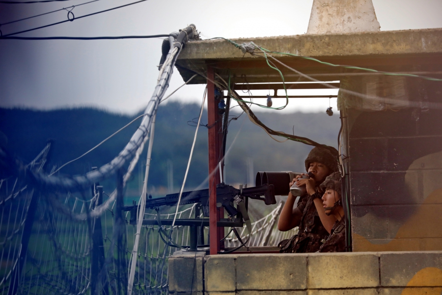 A South Korean soldier stands guard at a guard post near the demilitarized zone separating the two Koreas in Paju, South Korea, August 14, 2017. A South Korean soldier stands guard at a guard post near the demilitarized zone separating the two Koreas in Paju, South Korea, August 14, 2017.