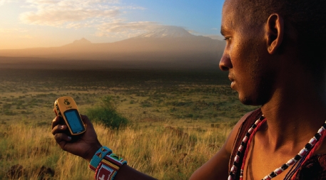 Lion Guardian Ng’ida takes a GPS point in front of Mt. Kilimanjaro. GPS data helps Lion Guardians track animals and keep livestock out of harm’s way. Lion Guardian Ng’ida takes a GPS point in front of Mt. Kilimanjaro. GPS data helps Lion Guardians track animals and keep livestock out of harm’s way.