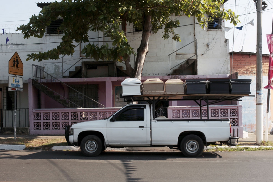 A pick-up truck transports unfinished coffins to another workshop in Jucuapa. A pick-up truck transports unfinished coffins to another workshop in Jucuapa.