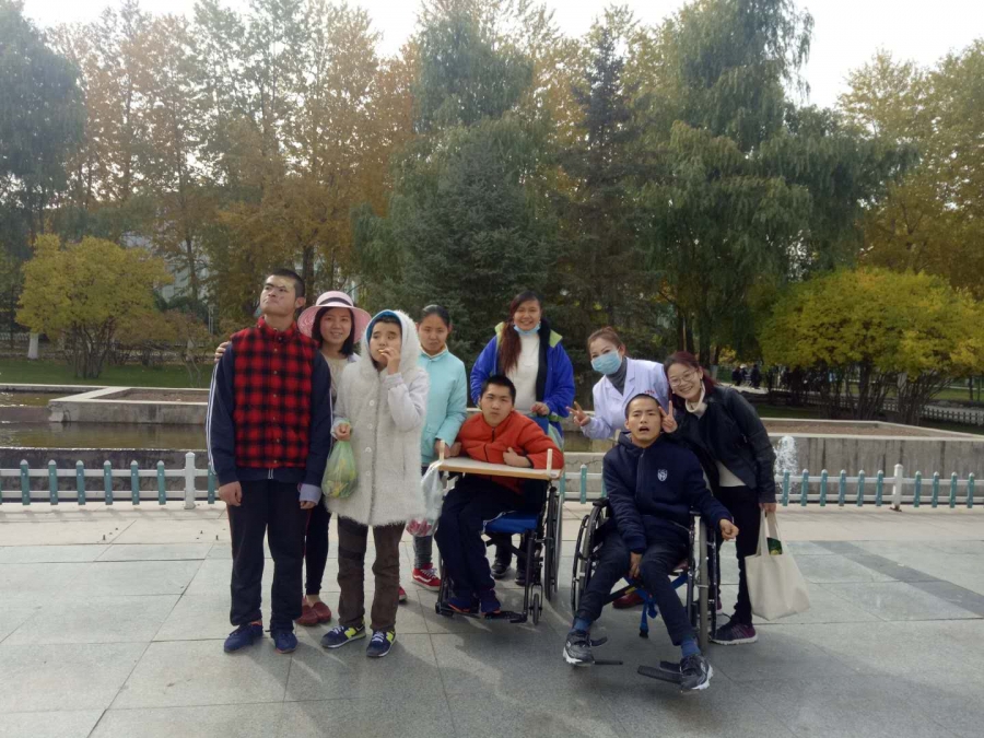 Bingjie Turner and Abigail Anderson with residents at the Xinxin Children's Home Bingjie Turner and Abigail Anderson with residents at the Xinxin Children's Home