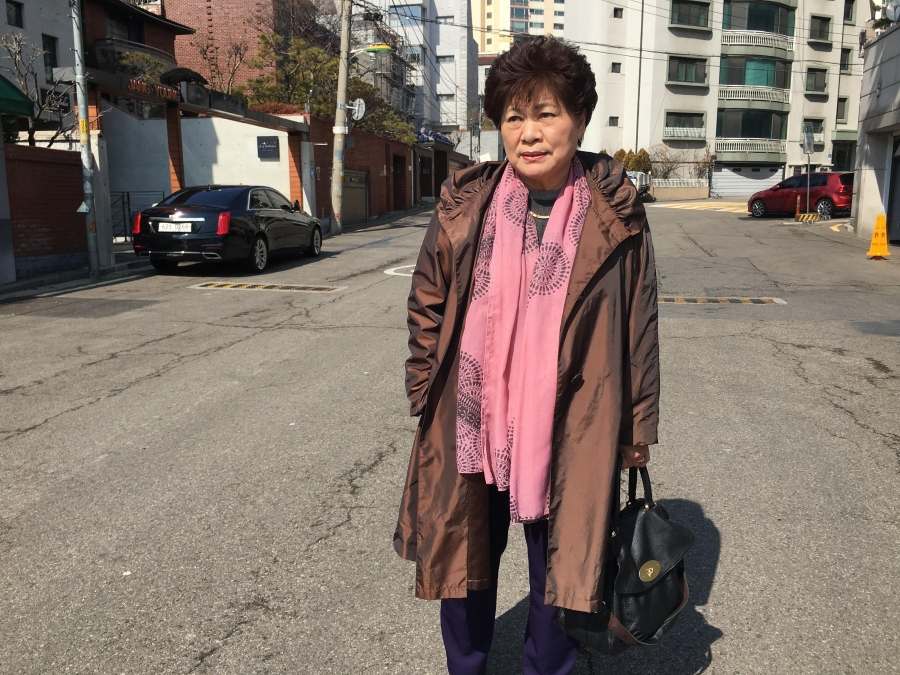 Sue Kinsler has supported North Koreans with disabilities for 20 years. Portrait of Sue Kinsler, a Christian missionary who helps North Korean disabilities, wearing a brown jacket and pink scarf.