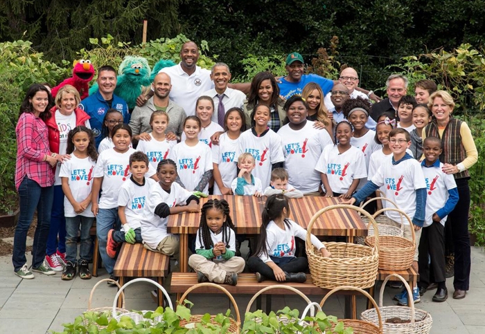 Will Allen (back row, right) at a 2016 White House garden event, alongside Barack and Michelle Obama, Alonzo Mourning, Sesame Street characters and many others.