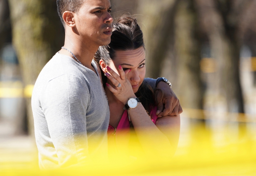 People react to an incident where a van struck multiple people at a major intersection in Toronto's northern suburbs. People react to an incident where a van struck multiple people at a major intersection in Toronto's northern suburbs.