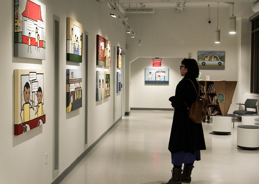A woman looks at the exhibit, "Kulap: New Works by Bren Bataclan" at the BCNC Pao Arts Center in Boston. A woman looks at the exhibit, "Kulap: New Works by Bren Bataclan" at the BCNC Pao Arts Center in Boston.