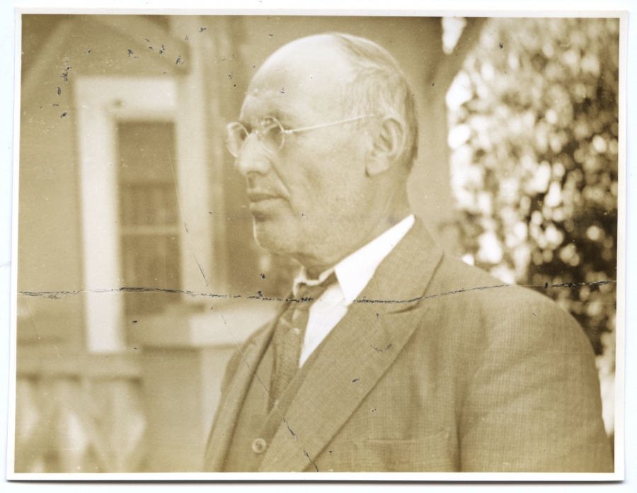 Sepia portrait of man in suite, side profile