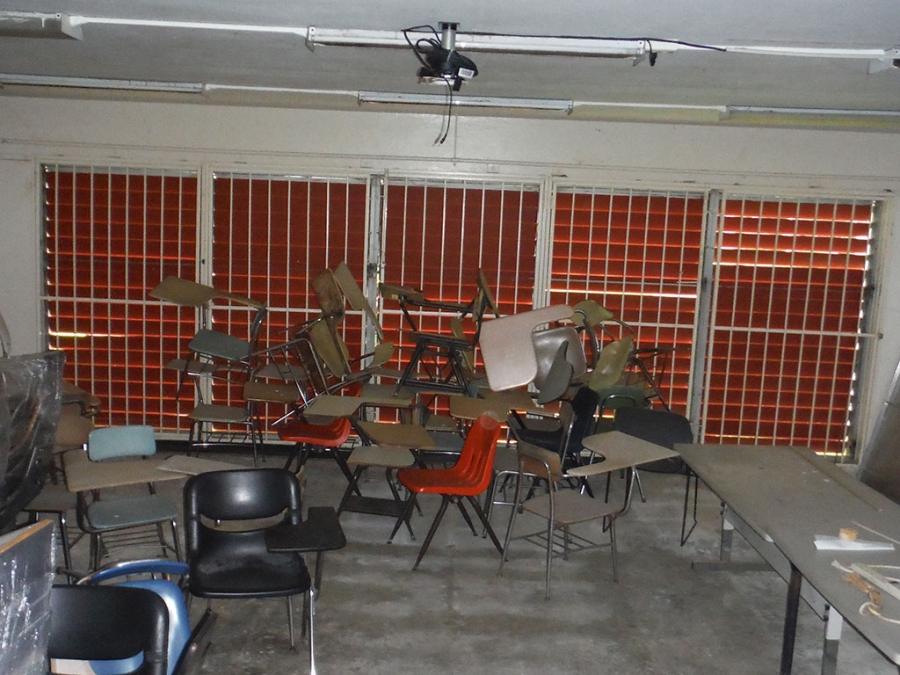 University of Puerto Rico at Mayagüez A bunch of chairs piled up in a classroom.