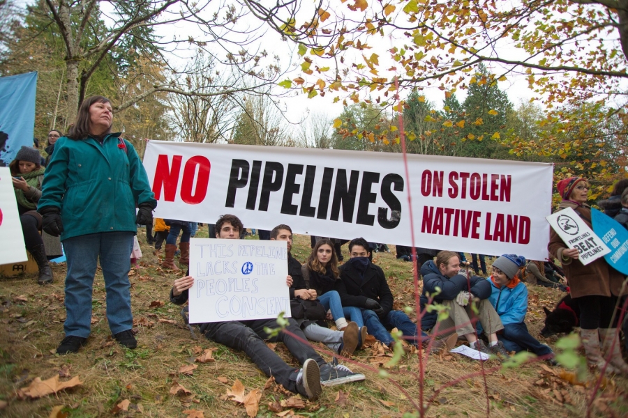 Kinder Morgan Pipeline Protest Protestors hold up signs at a rally against a proposed Kinder Morgan oil pipeline expansion on Burnaby Mountain in 2014 in British Columbia. In late May, the Canadian government announced it would fund an expansion project for the Kinder Morgan Trans Moun